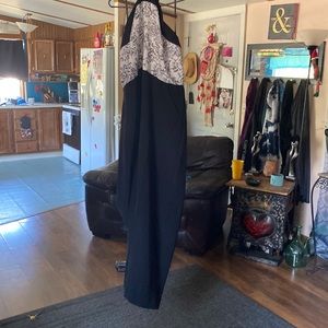 Jumpsuit with open back. It’s black and white  size 22